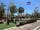Lush outdoor community area with fitness equipment and play space in a residential neighborhood