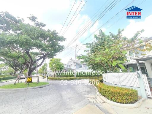 Street view of residential neighborhood with homes and paved streets