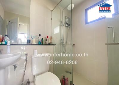 Modern bathroom with shower and toiletries