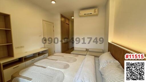 Bright and cozy bedroom with twin beds and air conditioning