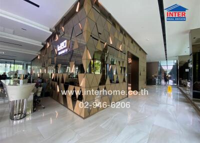 Modern and stylish commercial building lobby with mirrored geometric wall panels