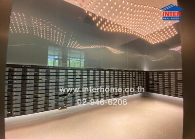 Modern lobby interior with stylish ceiling lights and mailboxes