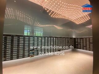 Modern lobby interior with stylish ceiling lights and mailboxes