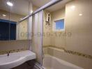 Spacious bathroom with modern fixtures and bathtub