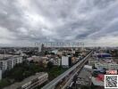 Panoramic city view with expansive skyline and nearby expressway