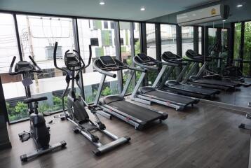 Modern residential gym with various fitness equipment