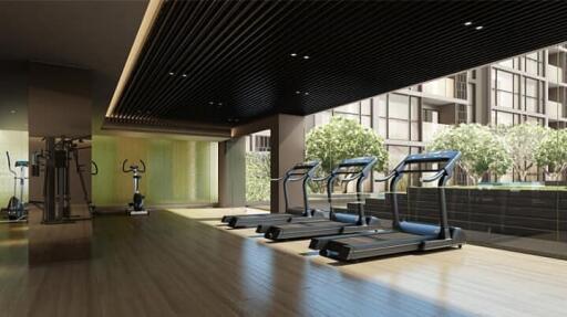 Modern gym interior with treadmills and exercise equipment in a residential building