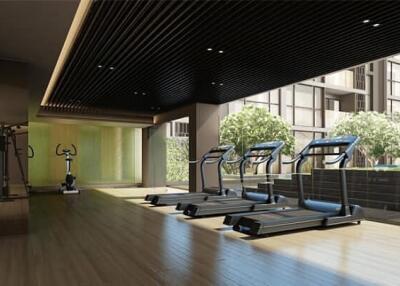 Modern gym interior with treadmills and exercise equipment in a residential building