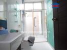 Bright and modern bathroom with glass shower and windows