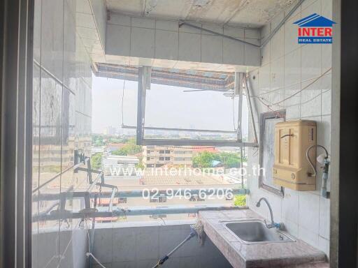Urban apartment kitchen with cityscape view