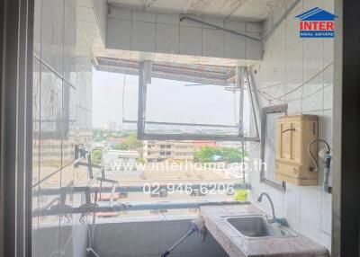 Urban apartment kitchen with cityscape view