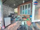Spacious covered outdoor kitchen with appliances and storage