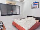 Spacious bedroom with air conditioning and large bed