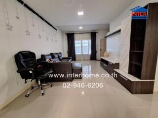 Spacious modern living room with comfortable seating and sleek entertainment unit