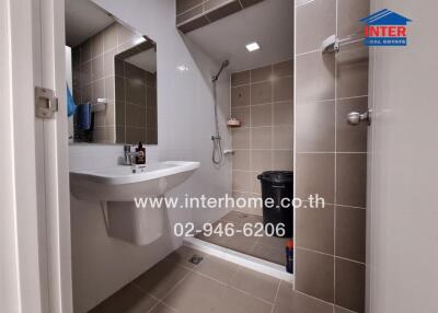 modern bathroom interior with a sink, mirror, and shower