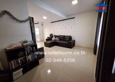 Spacious living room with modern sofa and bookcase