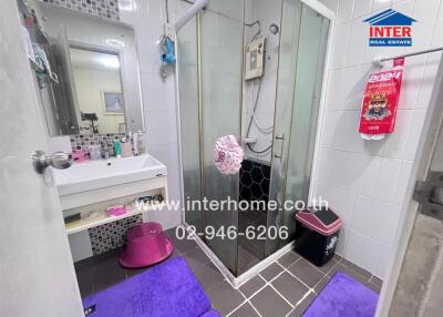 Modern bathroom with shower and comprehensive amenities