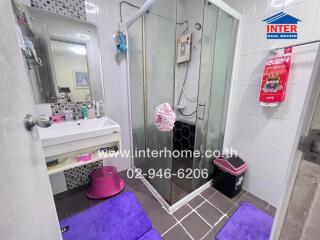 Modern bathroom with shower and comprehensive amenities