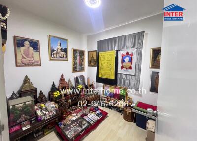 Decorated living room with religious and cultural artifacts