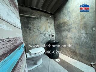 Compact unrenovated bathroom with visible mold and basic fixtures