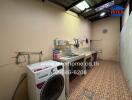 Spacious utility room with washing facilities and storage