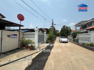 Residential street view with houses and parked car