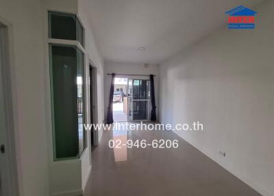 Spacious unfurnished bedroom with balcony access