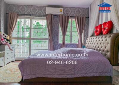 Elegant bedroom with vintage style wallpaper and modern amenities