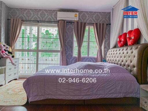 Elegant bedroom with vintage style wallpaper and modern amenities