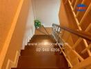 Interior view of a residential staircase with wooden steps and cozy decor