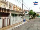 Suburban two-story home with secure gate and sheltered carport