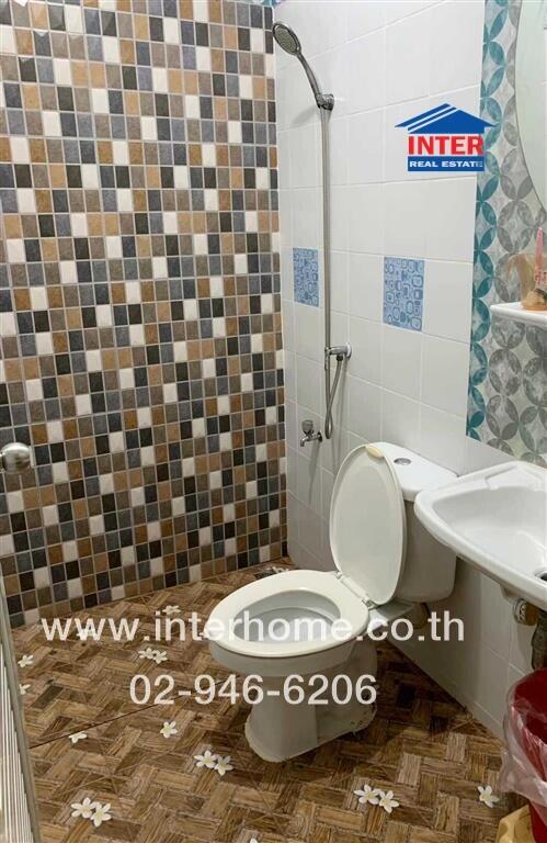 Compact bathroom with tiled walls and flooring