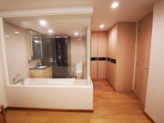 Modern bathroom with visible bedroom and hallway