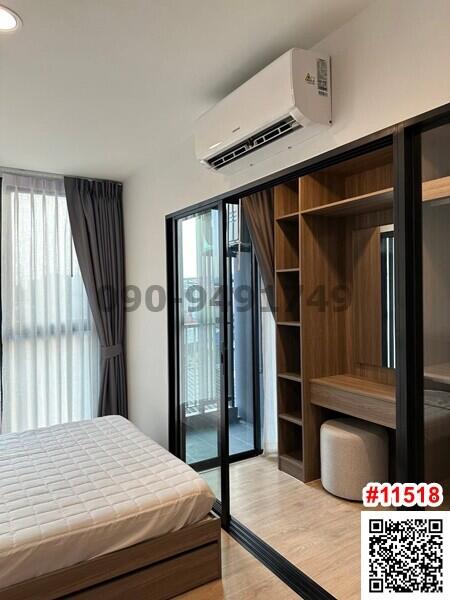 Modern bedroom with air conditioning and built-in wardrobe