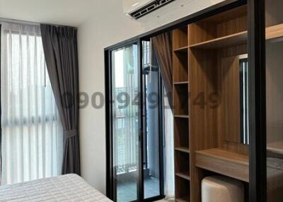 Modern bedroom with air conditioning and built-in wardrobe