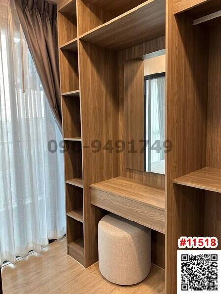 Modern bedroom with built-in wooden shelving and desk unit