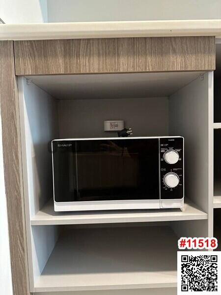 Modern microwave in a built-in kitchen shelf