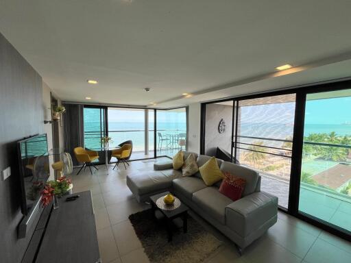 Spacious living room with ocean view and modern furniture