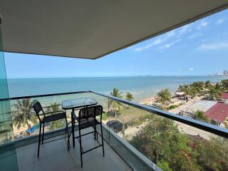 Spacious balcony overlooking the sea with outdoor seating