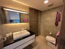 Modern bathroom with large mirror and elegant fixtures