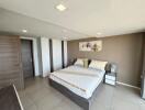 Spacious modern bedroom with a large bed and elegant decor
