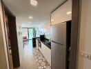 Modern kitchen with extended countertop and view into the living room