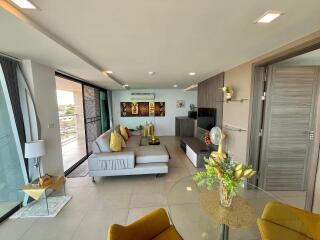 Spacious modern living room with abundant natural light and contemporary decor