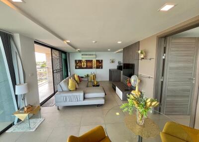 Spacious modern living room with abundant natural light and contemporary decor