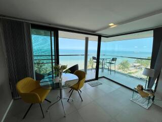Bright and modern living room with ocean view and balcony access