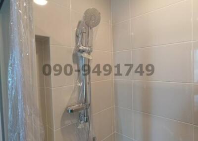 Modern bathroom interior with wall-mounted shower
