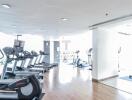 Spacious gym with modern equipment in residential building