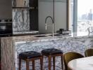 Modern kitchen with marble countertops and city skyline view