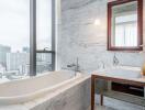 Modern bathroom with large windows overlooking the city