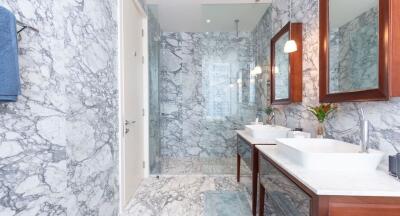 Luxurious marble tiled bathroom with modern fixtures
